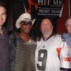 Hit Me America songwriters Brett Weller (far left) and Scott Lee Tully (far right) join Rockin Dopsie Jr in a photo with a music fan